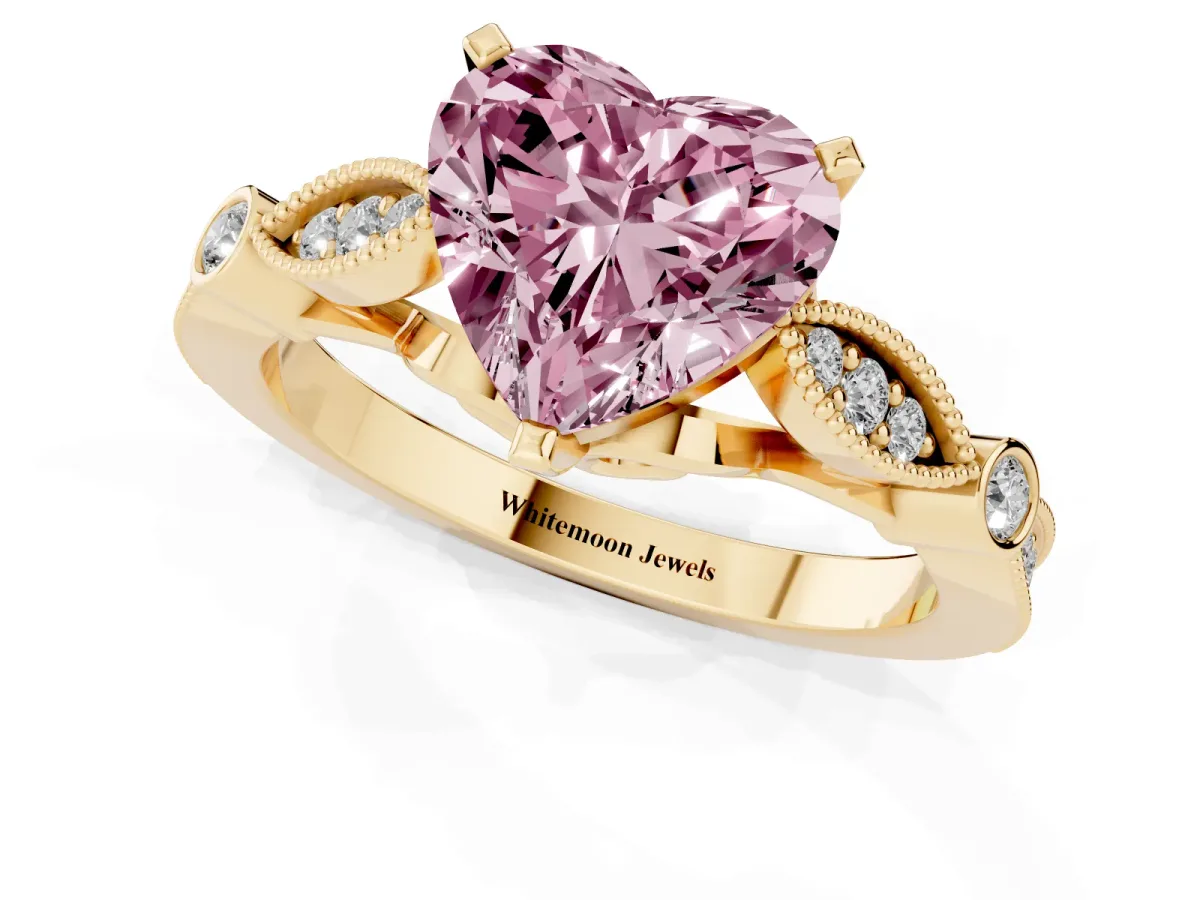 Fancy Pink Heart Cut Cut Diamond with Milgrain Marquise and Bezel Accents on a Solitaire Band with Prong Setting Yellow gold