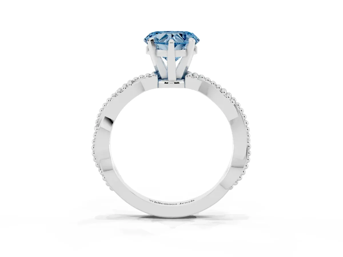 Fancy Blue Heart Cut Solitaire Twisted Band with Bead Prong Setting Platinum