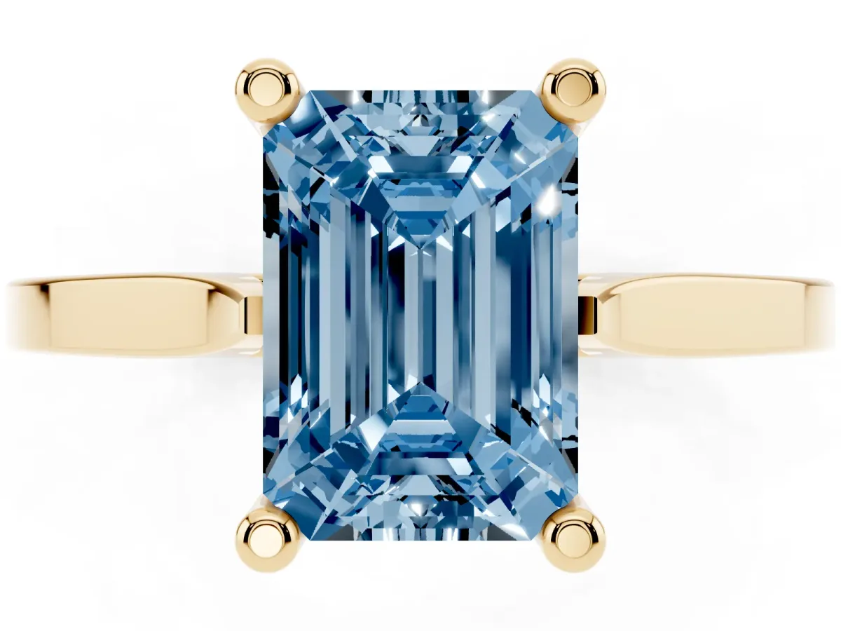 Fancy Blue Emerald Cut Solitaire Diamond Ring with Four-Prong Setting and Tapered Band Yellow gold