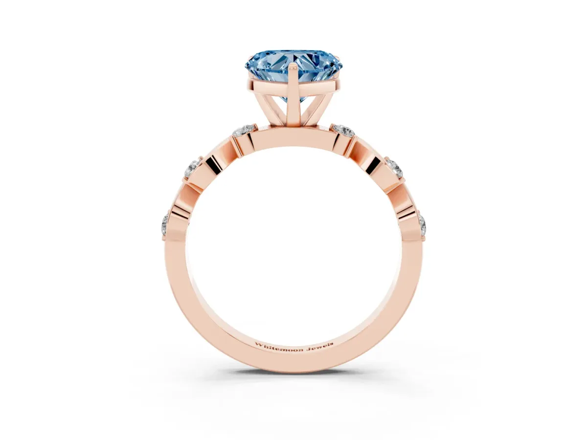 Fancy Blue Heart Cut Diamond Solitaire Twisted Band with Round Accents and Prong Setting Rose gold