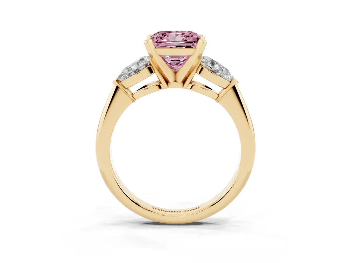 Fancy Pink Three-Stone Princess Cut Diamond Ring with Pear Side Stones and Four-Prong Setting Yellow gold