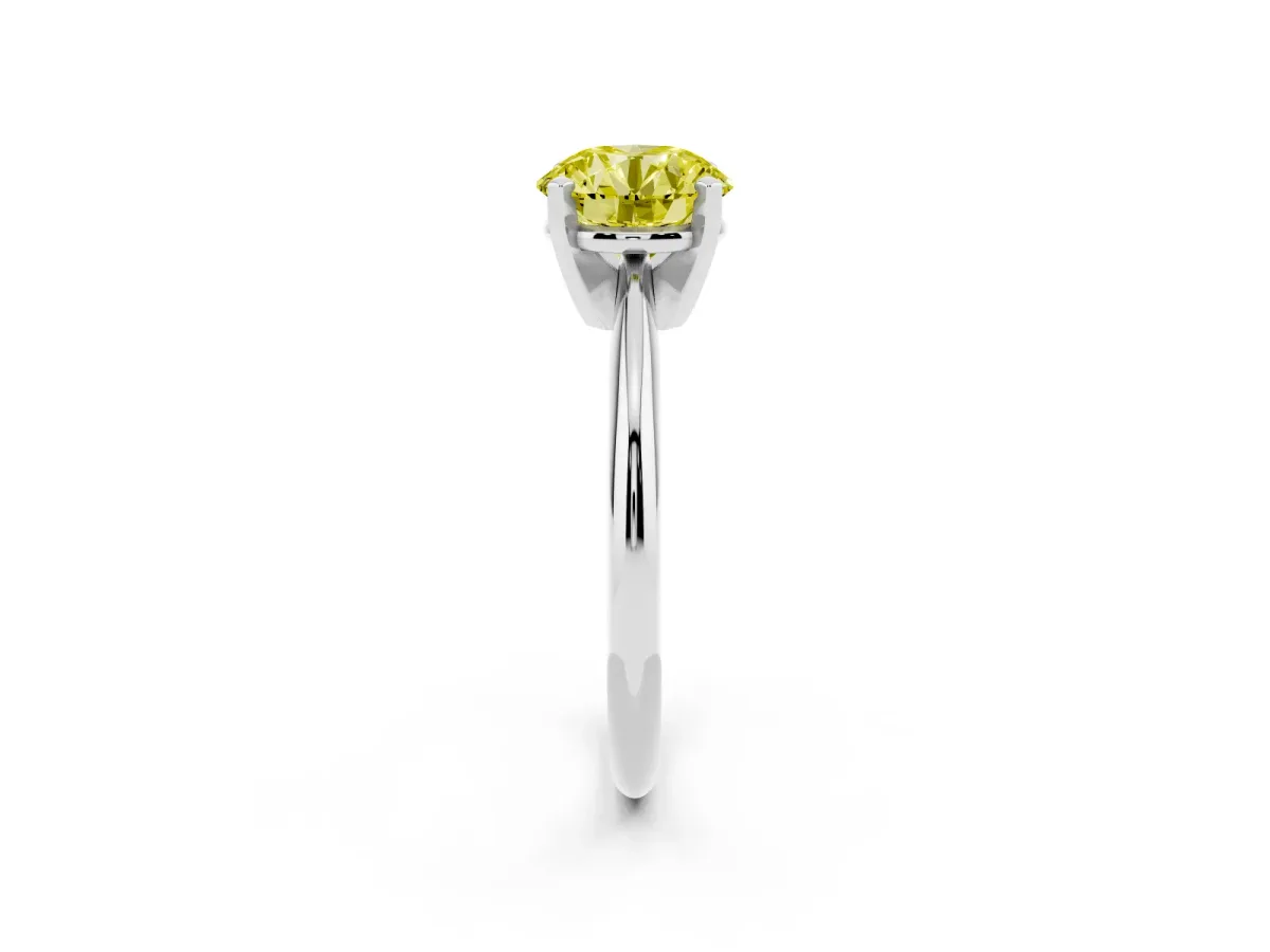 Fancy Yellow Round Cut Cut Solitaire Ring with Four-Prong Setting on a Classic Band Silver