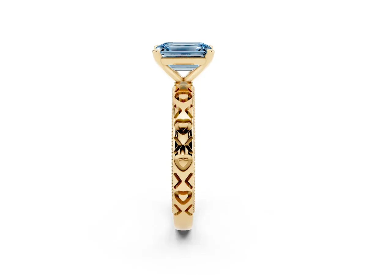 Fancy Blue Emerald Cut Solitaire Diamond Engagement Ring with XO Engraved Band and Four-Prong Setting Yellow gold