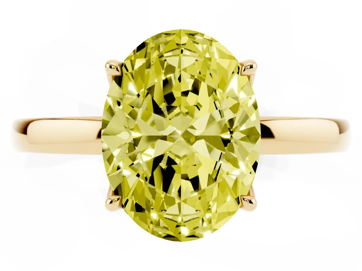 Fancy Yellow Oval Cut Diamond Solitaire Ring with Thin Band and Prong Setting Yellow gold