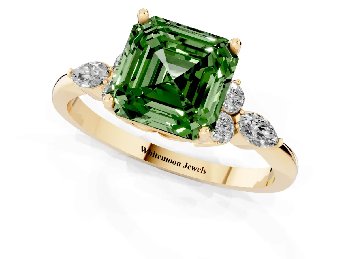 Fancy Green Asscher Cut Brilliant Diamond Solitaire Ring with Pear Side Stones and Four-Prong Setting Yellow gold