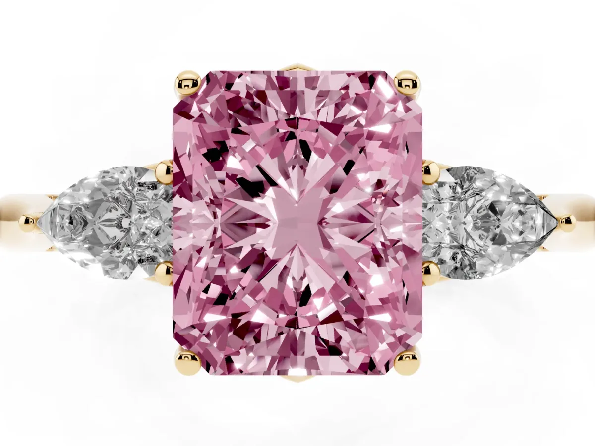 Fancy Pink Three-Stone Radiant Cut Brilliant Diamond Solitaire Ring with Tapered Band and Four-Prong Setting Yellow gold