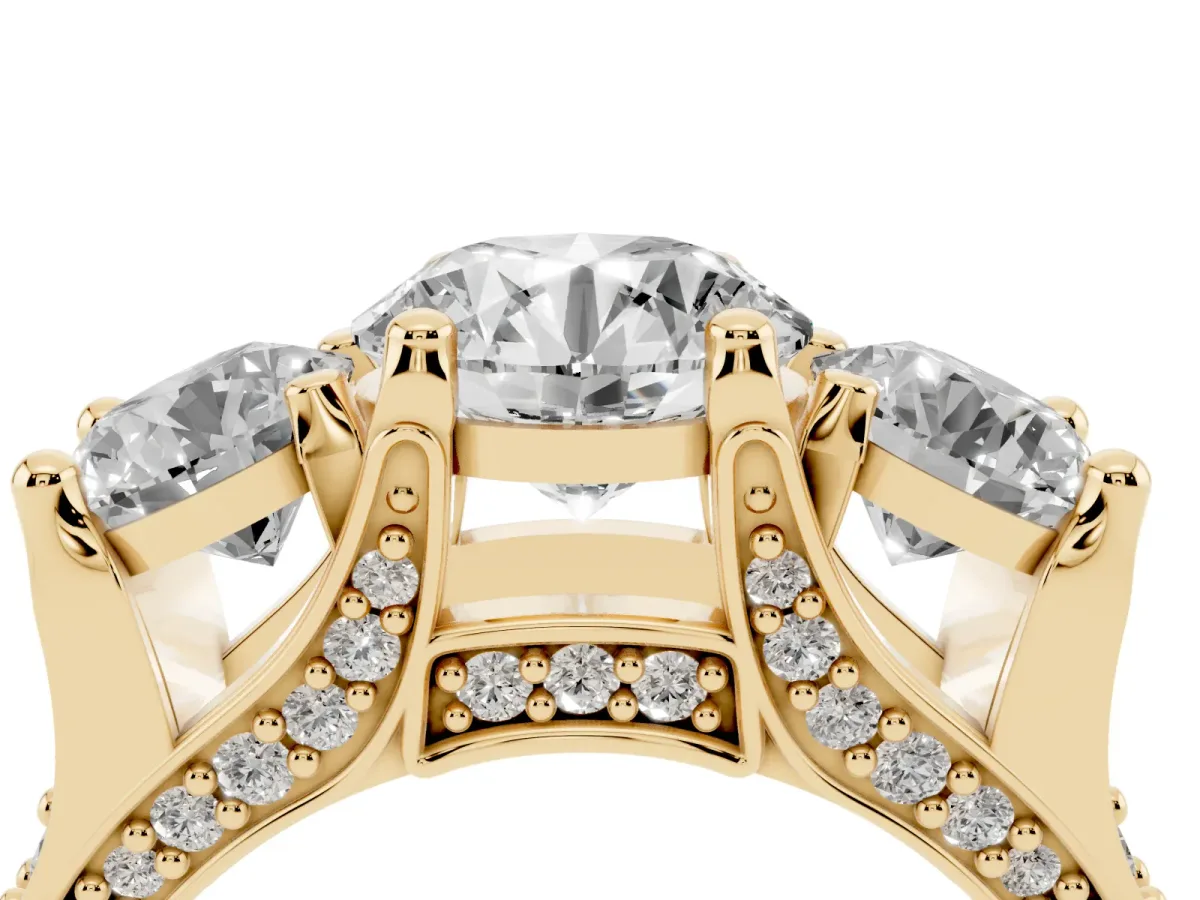 Round Cut Diamond Three-Stone Ring with Channel Set Band and Four-Prong Setting Yellow gold