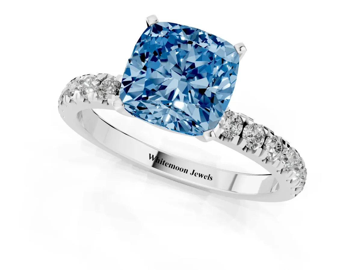 Fancy Blue Cushion Cut Diamond Solitaire Ring with Pavé Accents and Four-Prong Setting Silver