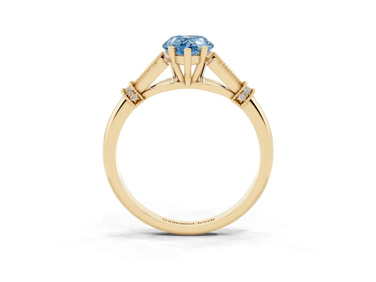 Fancy Blue Pear Cut Diamond Solitaire Ring with Floral Filigree and Pave Accents Yellow gold