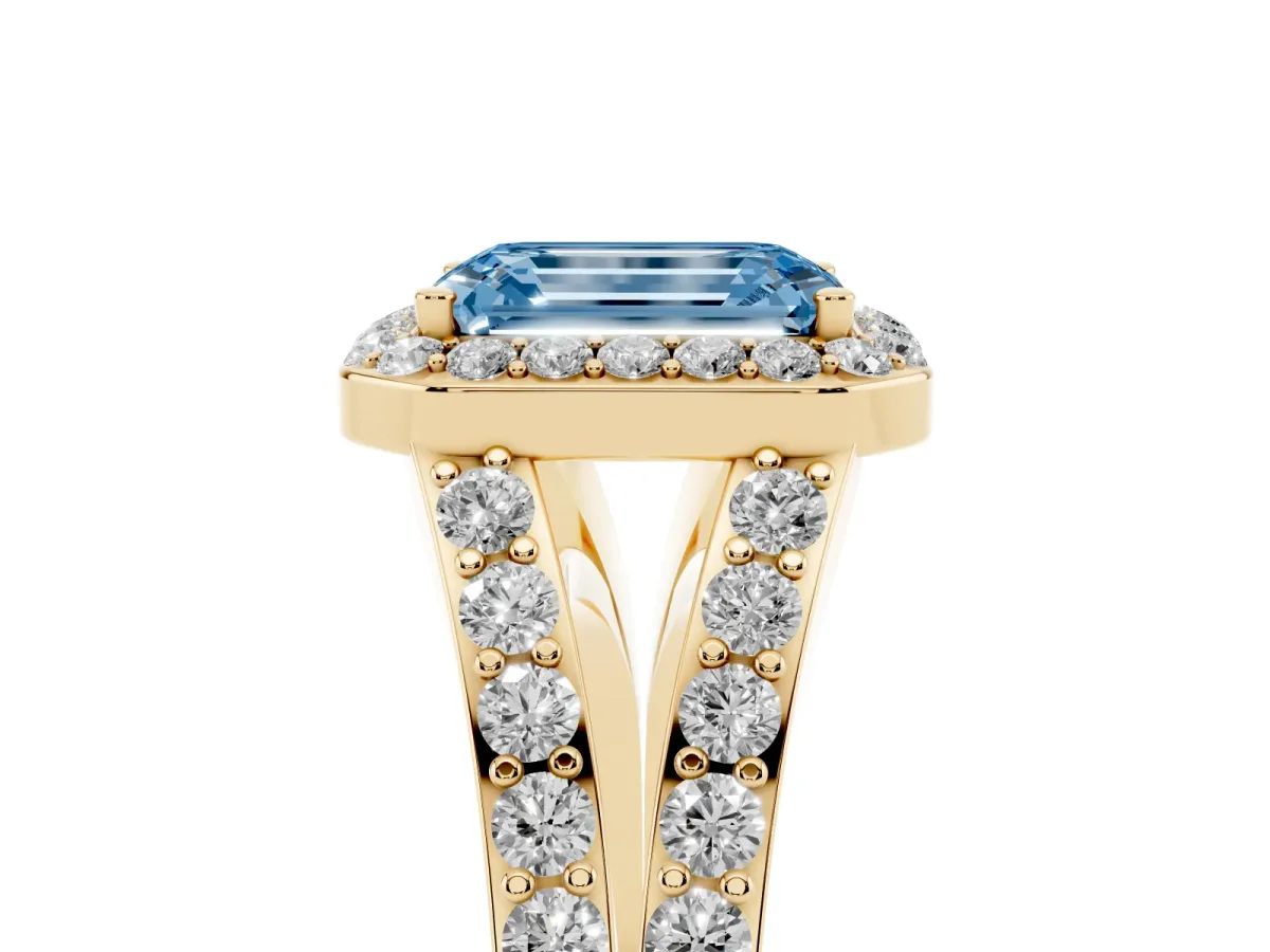 Fancy Blue Emerald Cut Diamond Split Shank Halo Ring with Four-Prong Setting Yellow gold