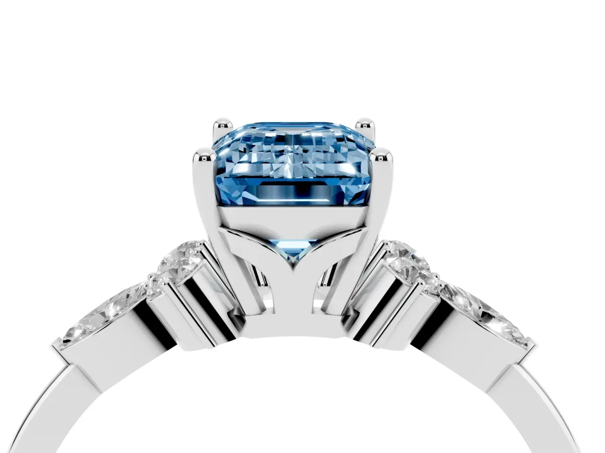 Fancy Blue Emerald Cut Brilliant Diamond Solitaire Ring with Pear Side Stones and Four-Prong Setting Silver