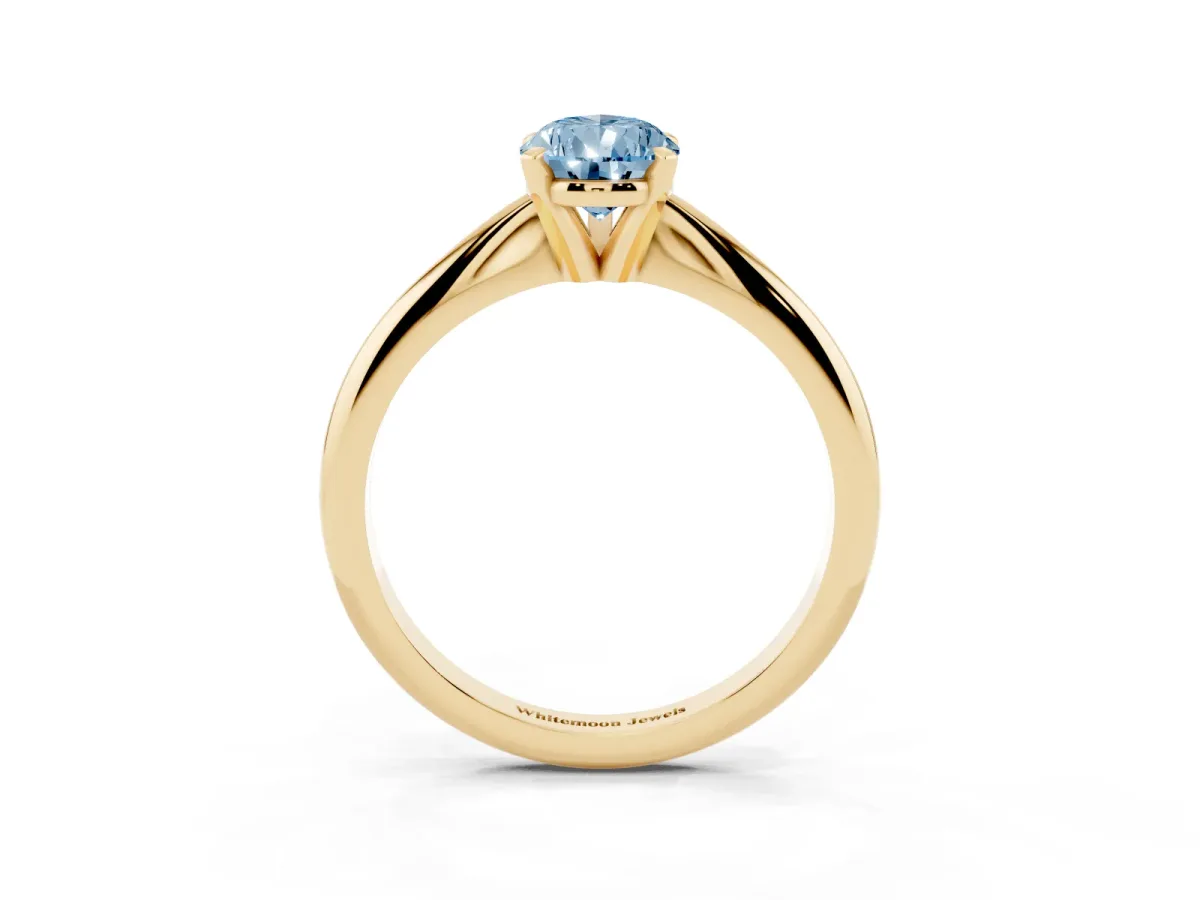 Fancy Blue Pear Cut Cut Solitaire Ring with Four-Prong Setting on a Classic Band Yellow gold
