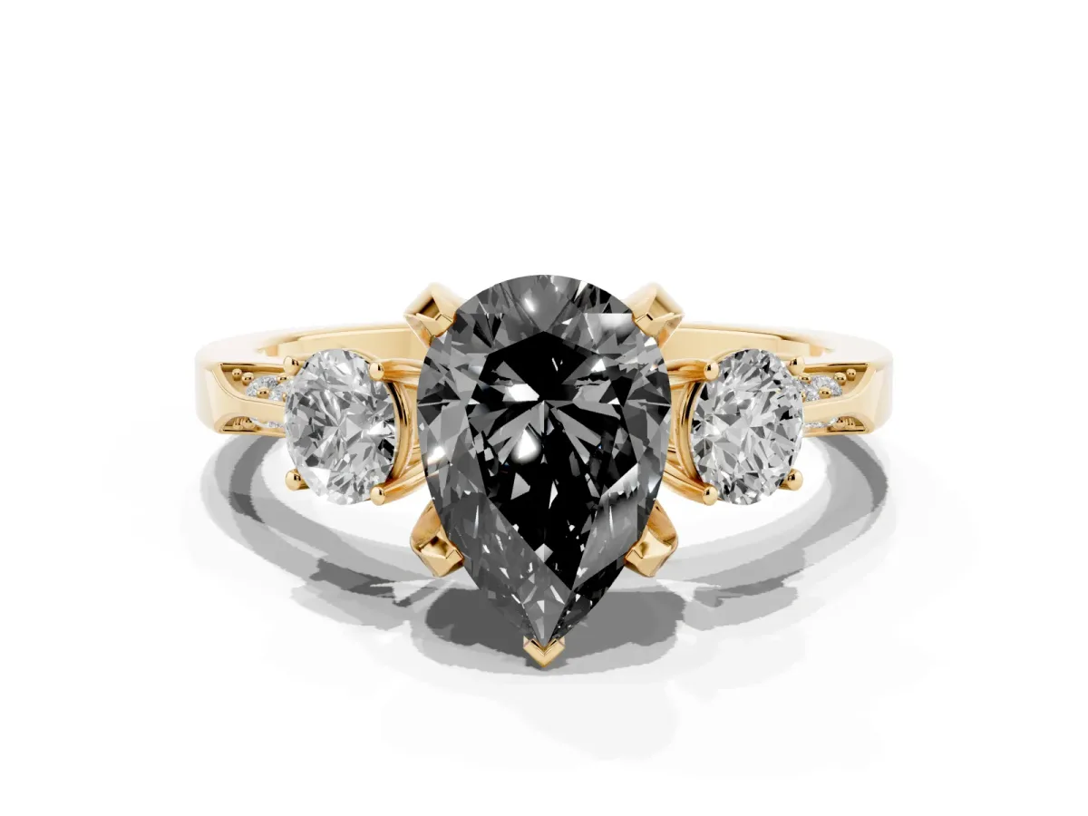 Fancy Black Pear Cut Brilliant Three-Stone Diamond Ring with Pavé Band and Four-Prong Setting Yellow gold