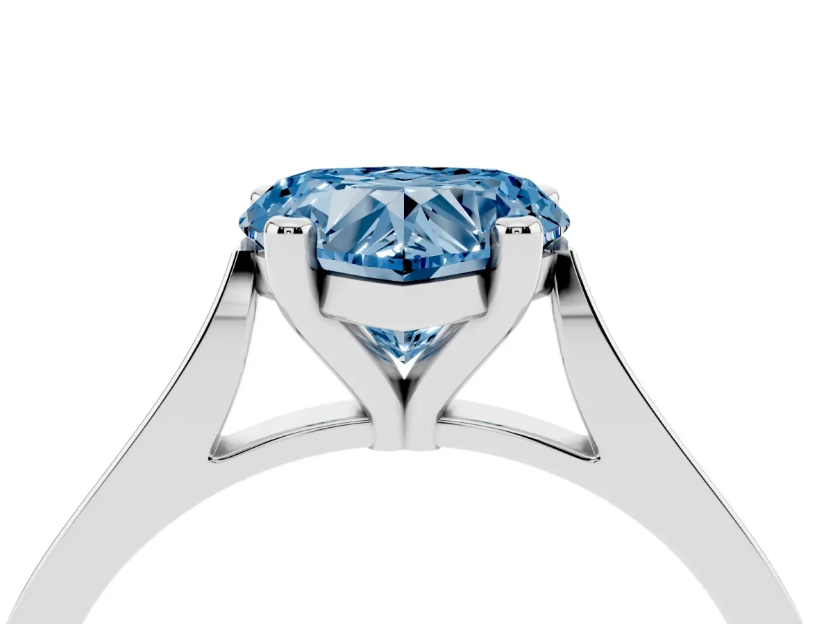 Fancy Blue Heart Cut Solitaire Diamond Ring with Four-Prong Setting and Tapered Band Platinum