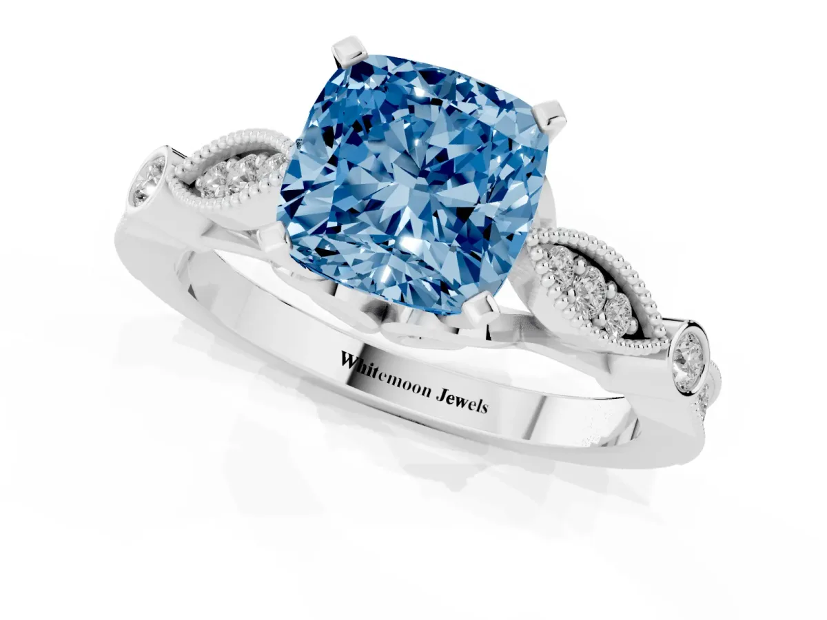 Fancy Blue Cushion Cut Cut Diamond with Milgrain Marquise and Bezel Accents on a Solitaire Band with Prong Setting White gold