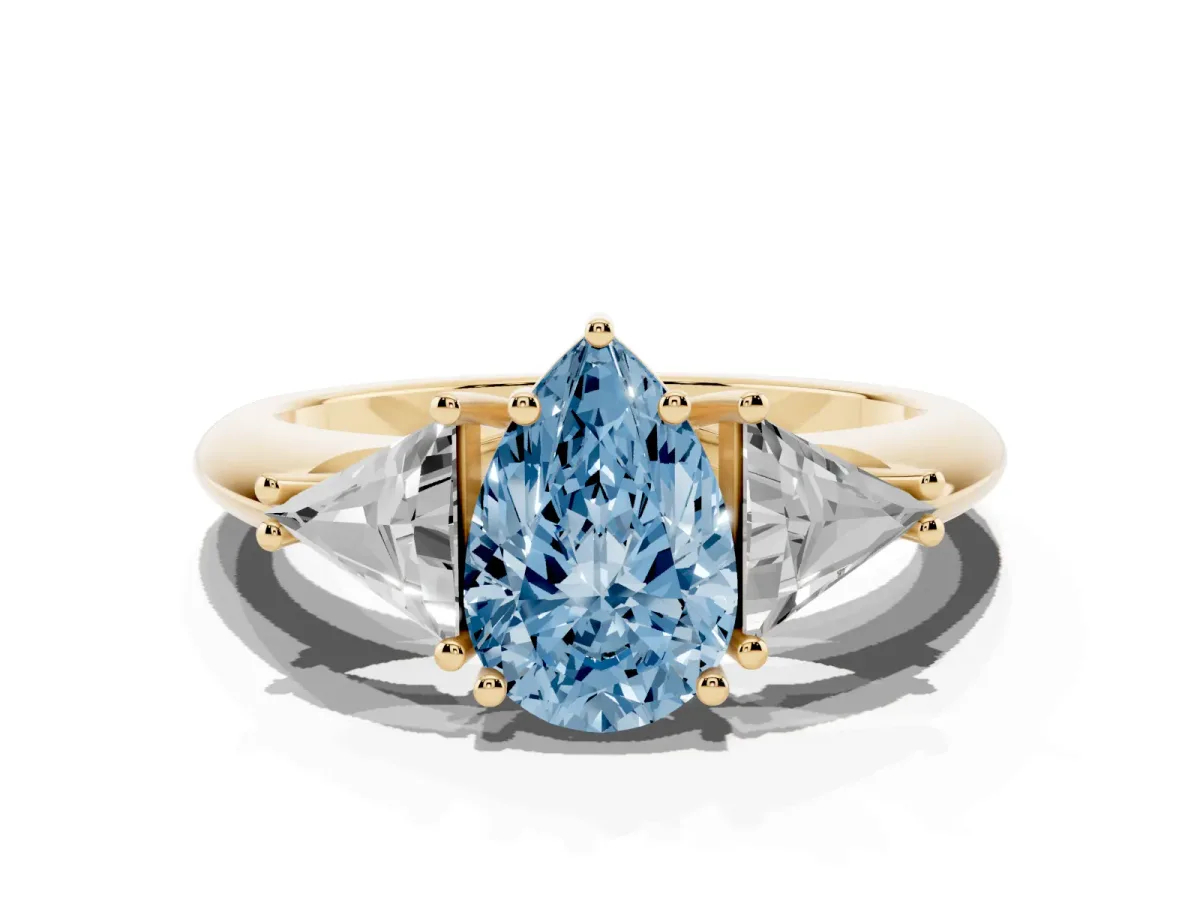Fancy Blue Three-Stone Pear Cut Diamond Engagement Ring with Trillion Side Stones and Prong Setting Yellow gold