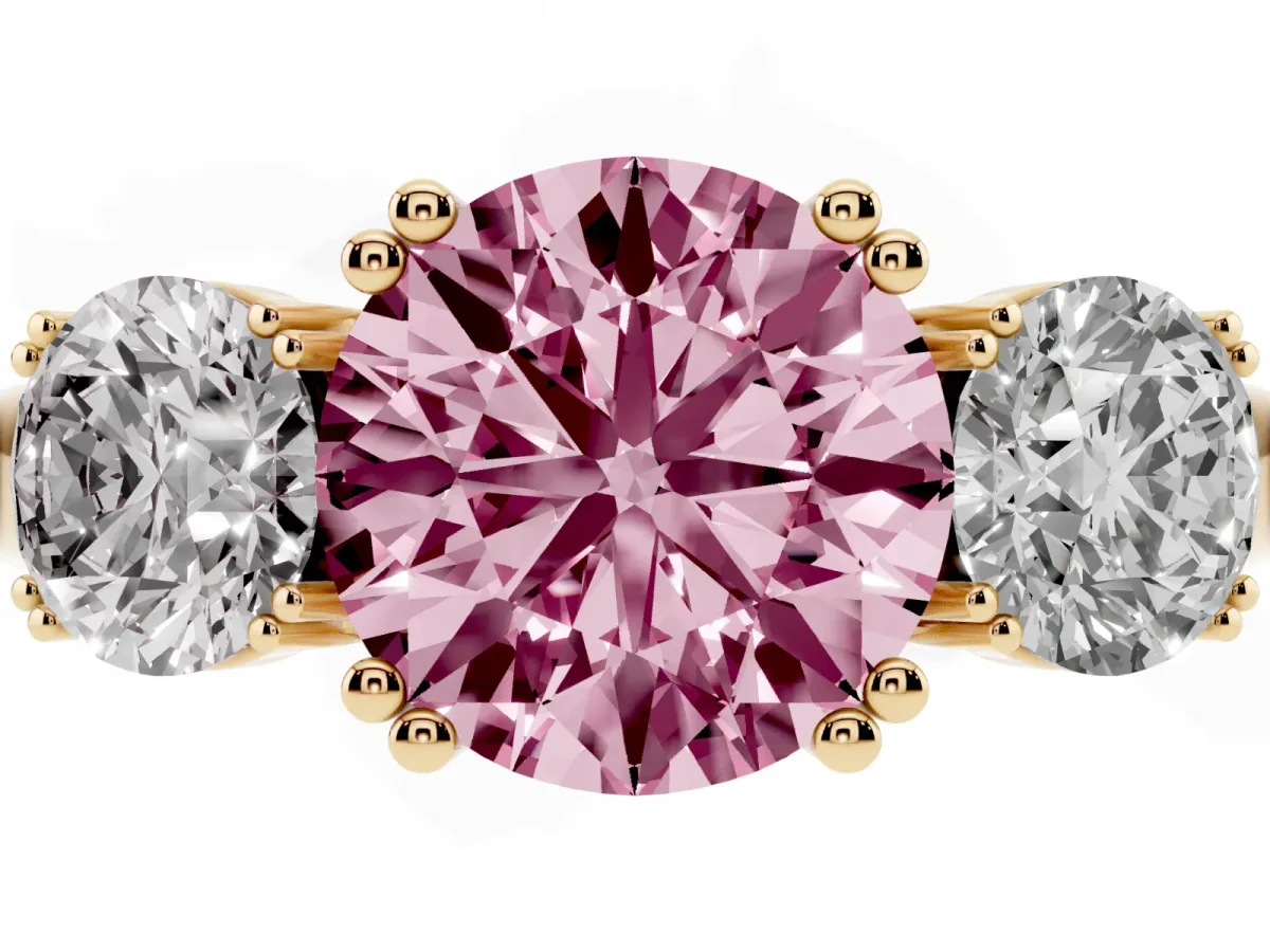 Fancy Pink Three-Stone Round Cut Cut Diamond Ring with Channel Set Band and Four-Prong Setting Yellow gold
