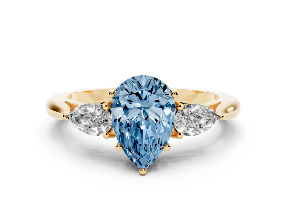 Fancy Blue Three-Stone Pear Cut Diamond Ring with Pear Side Stones in Four-Prong Setting Yellow gold