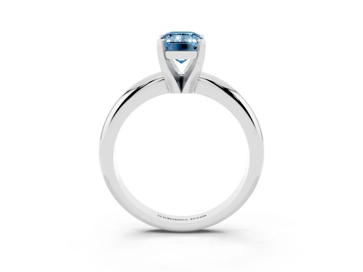 Fancy Blue Emerald Cut Diamond Solitaire Engagement Ring with Round Band and Four-Prong Setting Silver