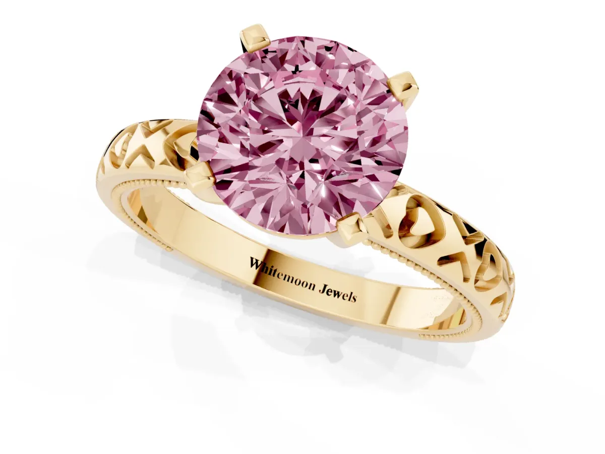Fancy Pink Round Cut Solitaire Diamond Engagement Ring with XO Engraved Band and Four-Prong Setting Yellow gold