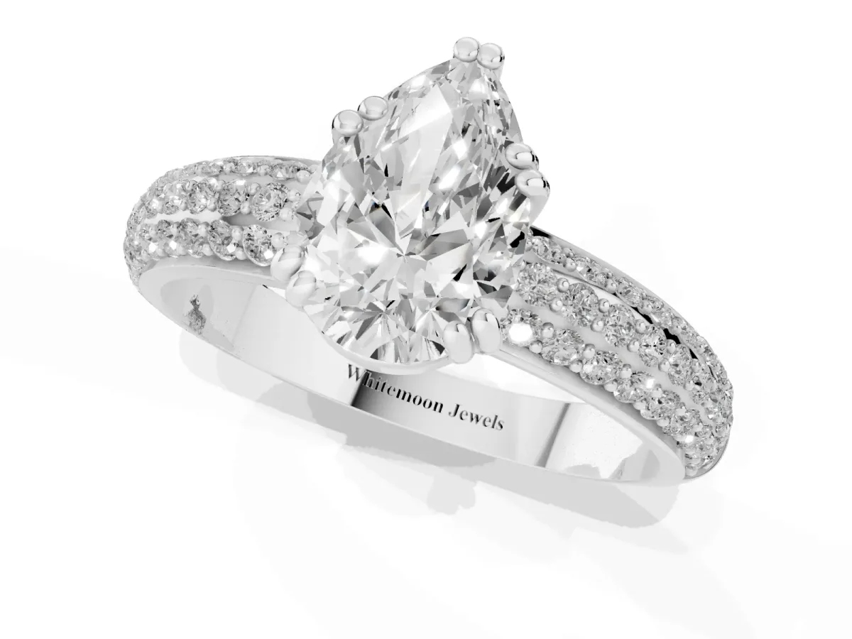 Pear Cut Diamond Solitaire Ring with Multi-Row Round Pavé Band and Prong Setting Silver