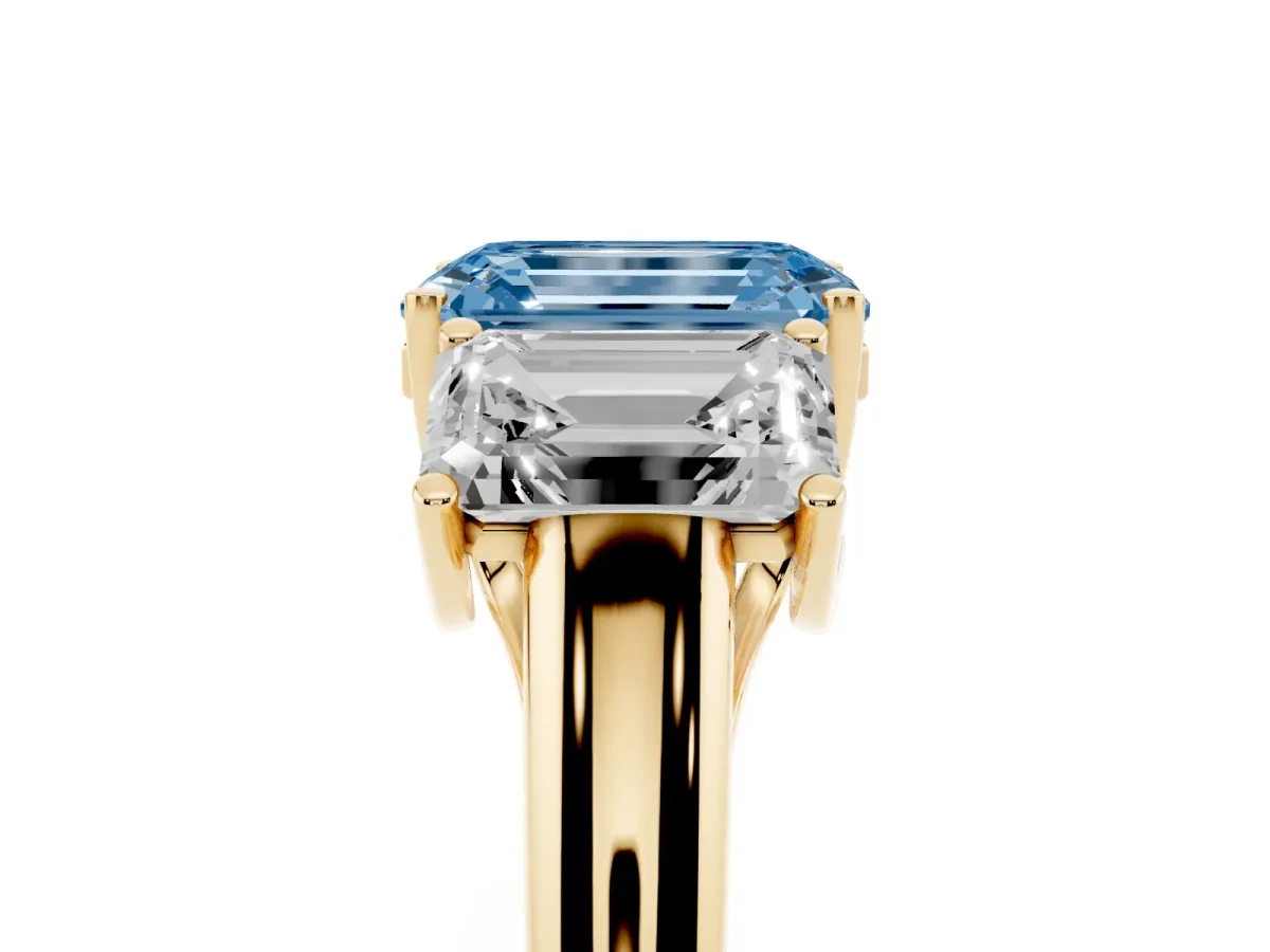 Fancy Blue Three-Stone Emerald Cut Diamond Engagement Ring with Prong Setting Yellow gold