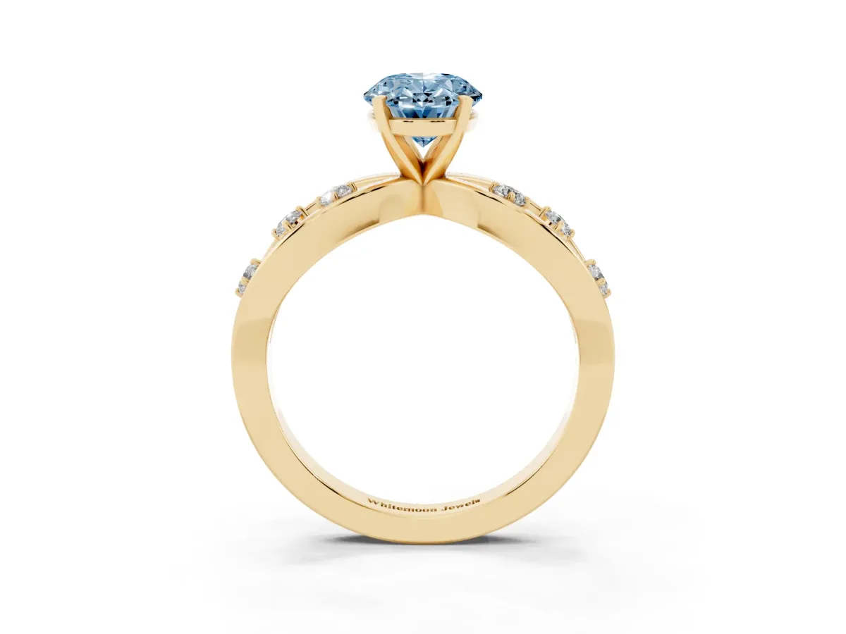 Fancy Blue Oval Cut Cut Solitaire Diamond with Side Stones on Criss-Cross Band and Four-Prong Setting Yellow gold