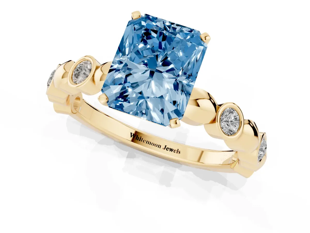 Fancy Blue Radiant Cut Solitaire Bezel-Set Diamond Ring with Beaded Band and Four-Prong Setting Yellow gold