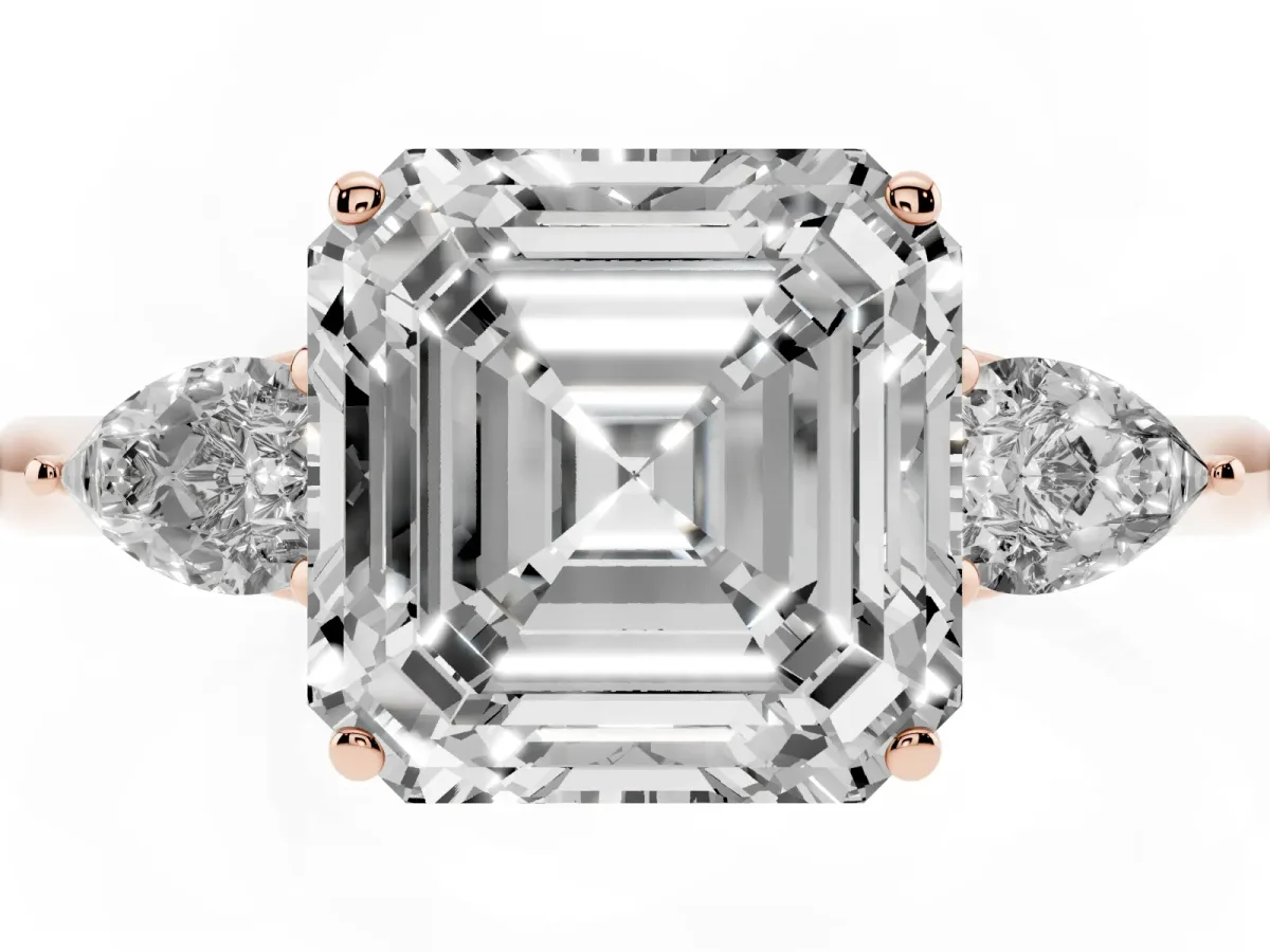 Three-Stone Asscher Cut Diamond Ring with Pear Side Stones in Four-Prong Setting Rose gold
