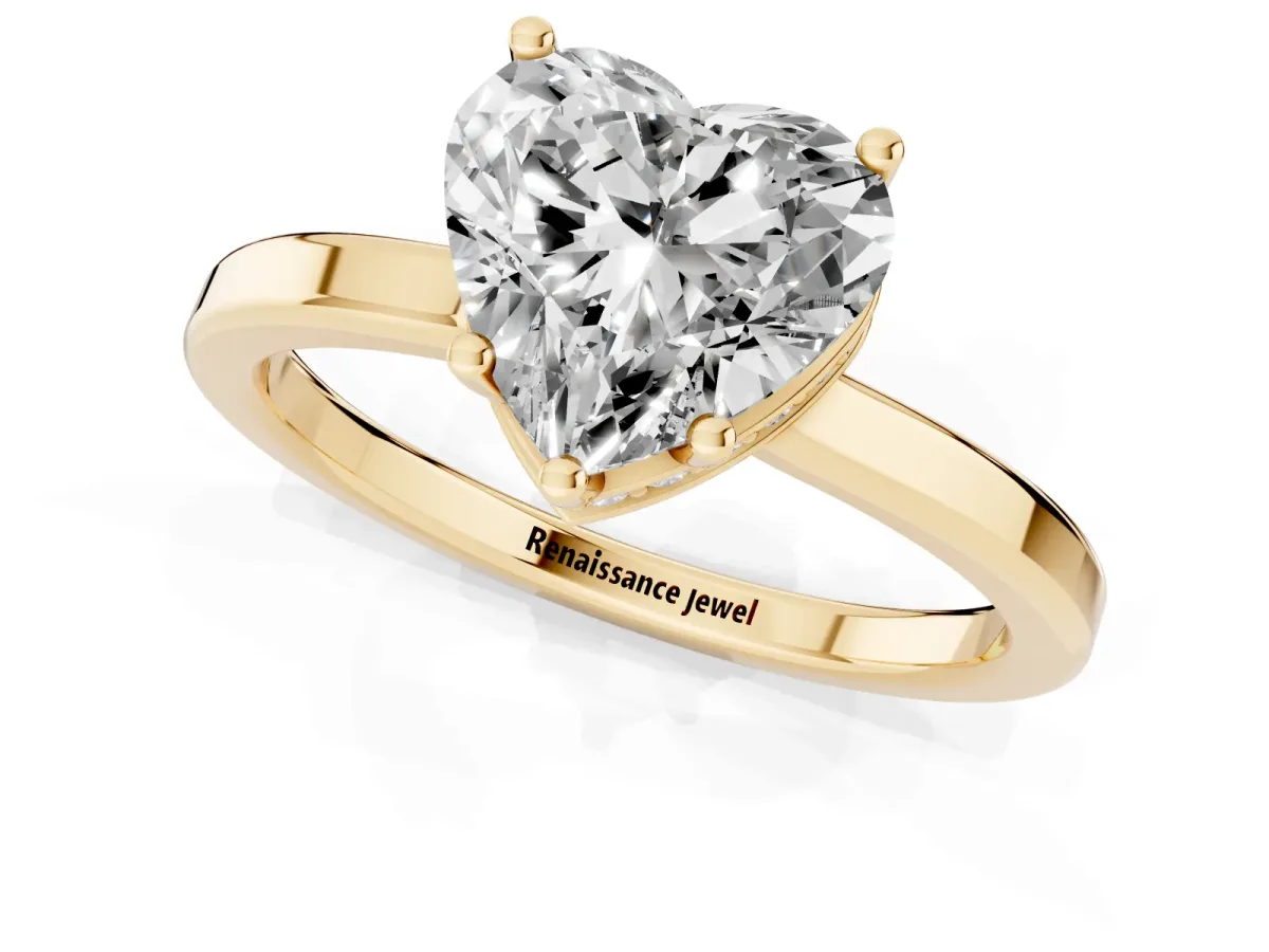 Heart Cut Cut Solitaire Engagement Ring with Four-Prong Setting on a Classic Band Yellow gold