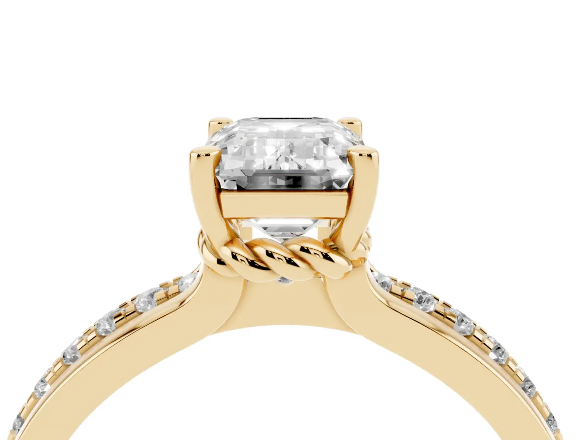 Emerald Cut Solitaire Diamond Ring with Channel Set Band and Six-Prong Setting Yellow gold
