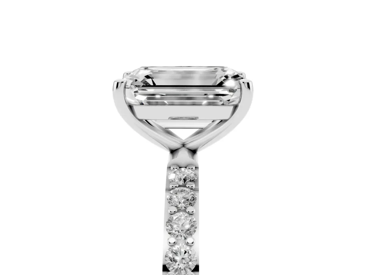 Emerald Cut Diamond Solitaire Ring with Round Pavé Shoulders and Prong Setting Silver