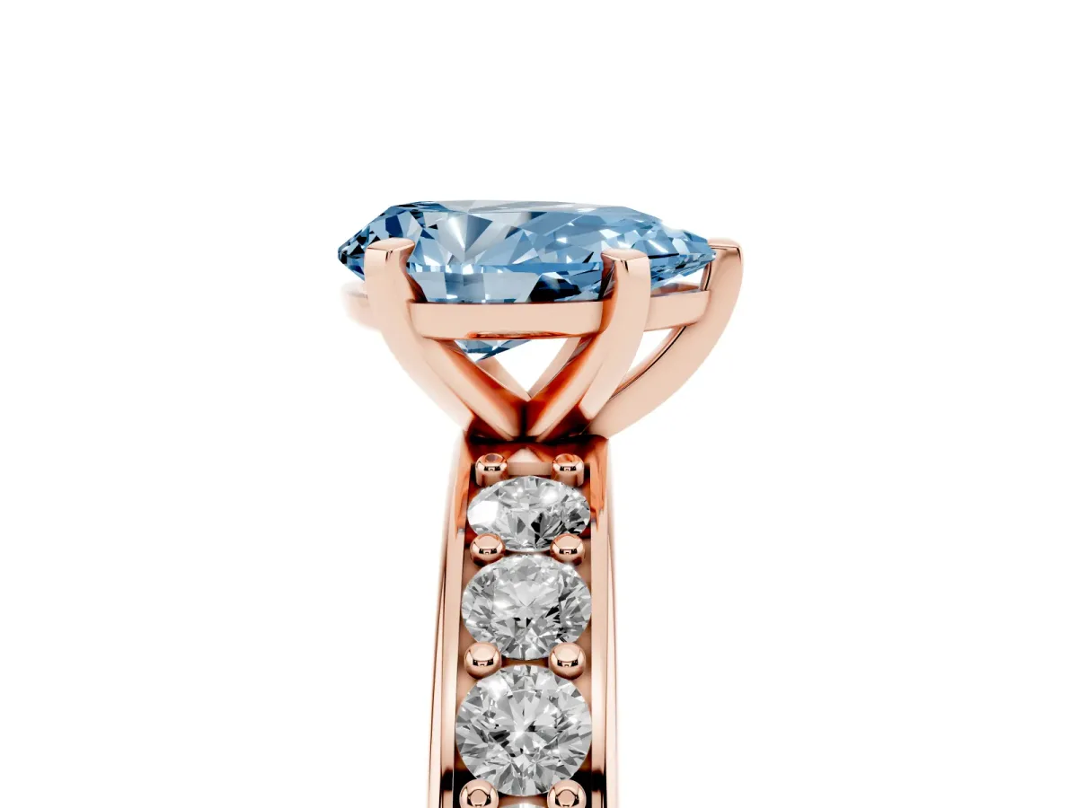 Fancy Blue Pear Cut Diamond Engagement Ring with Channel Set Round Band and Prong Setting Rose gold