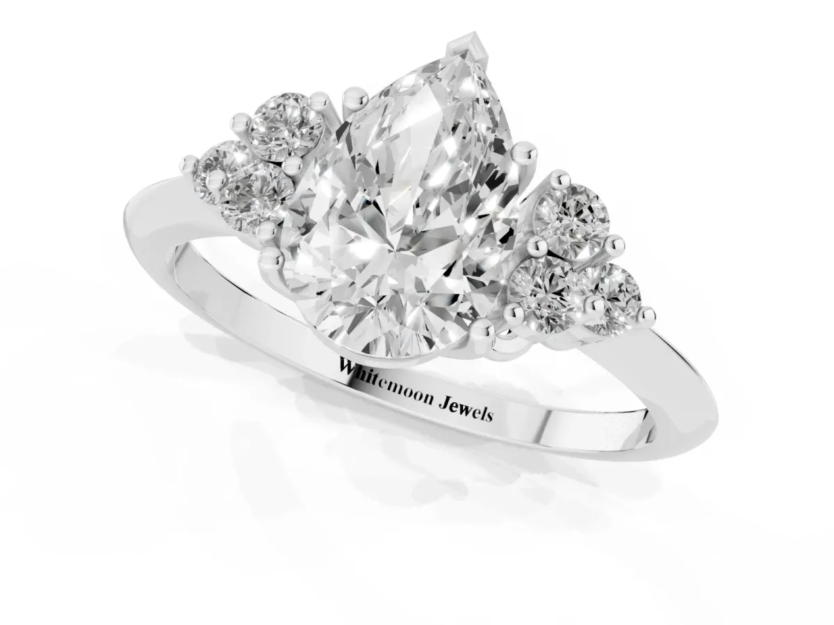 Pear Cut Cut Diamond Cluster Ring with Solitaire Band and Four-Prong Setting Silver