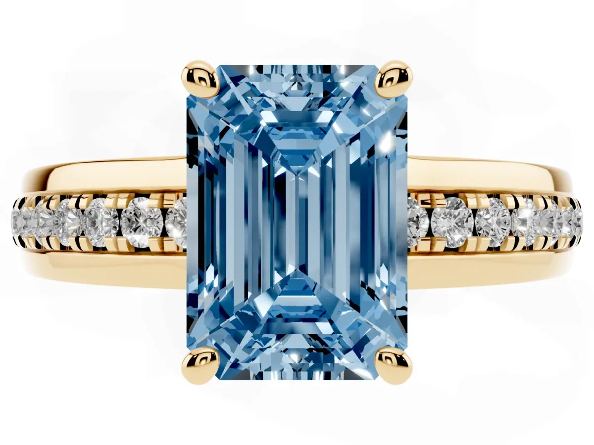 Fancy Blue Emerald Cut Solitaire Diamond Ring with Channel Set Band and Six-Prong Setting Yellow gold
