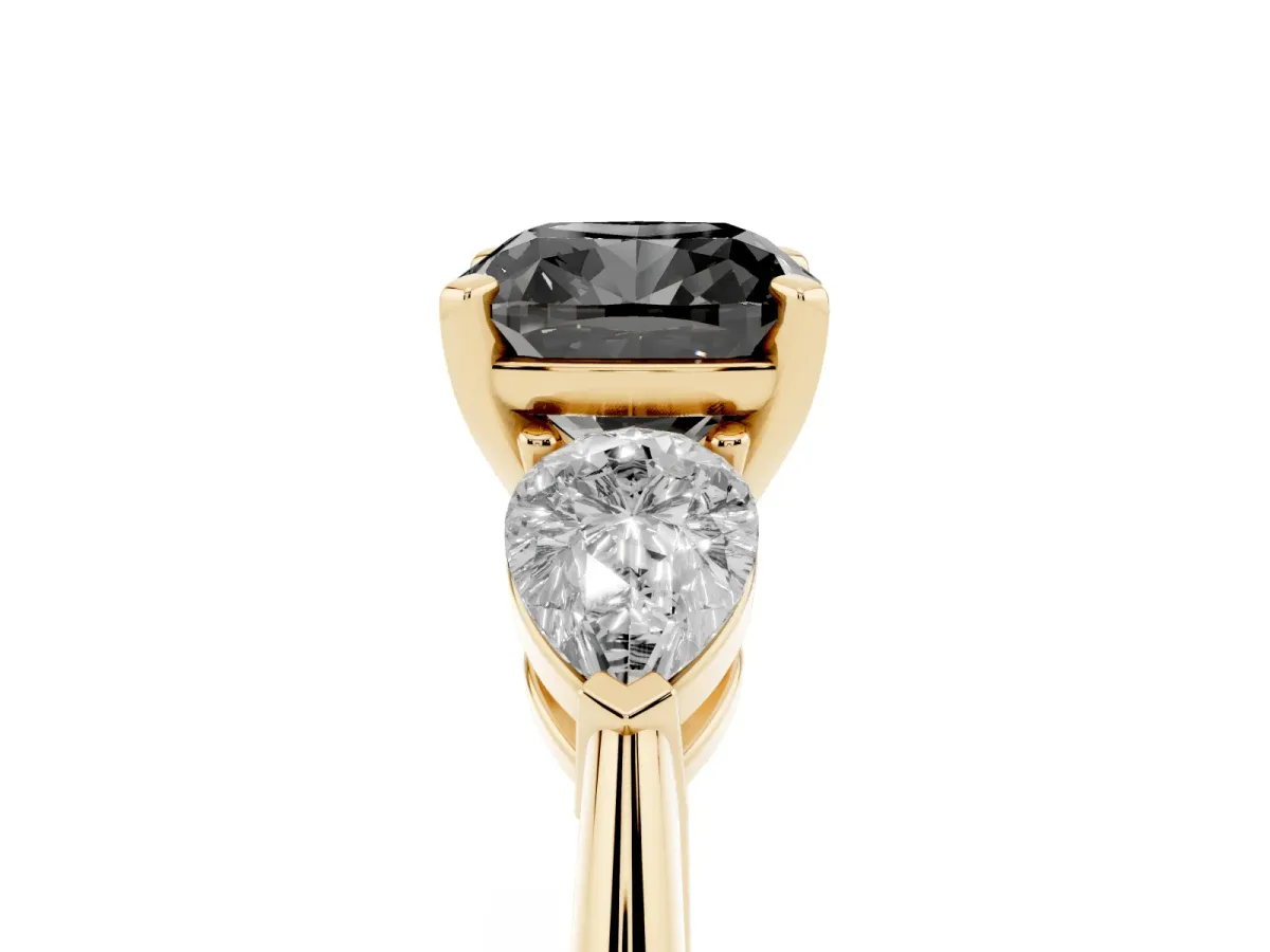 Fancy Black Three-Stone Cushion Cut Diamond Ring with Pear Side Stones and Four-Prong Setting Yellow gold