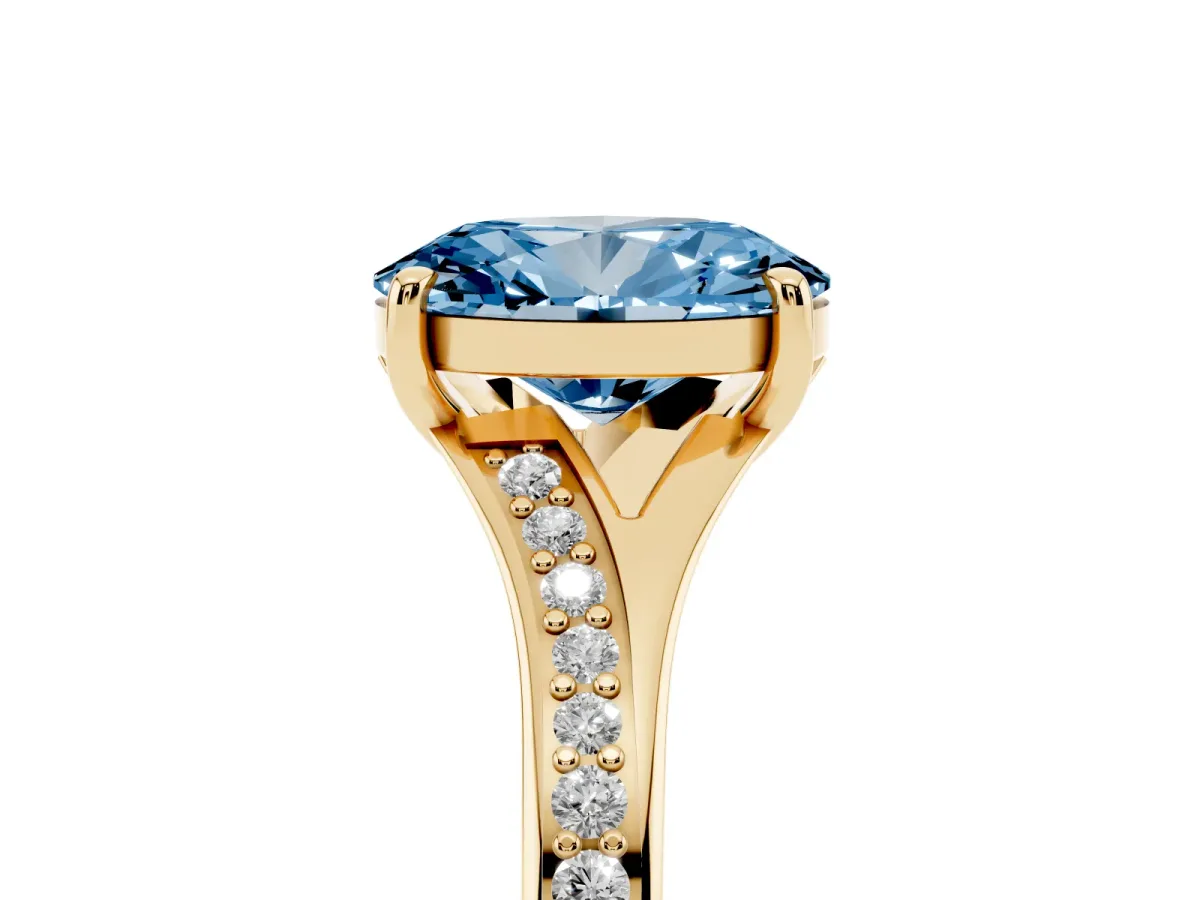 Fancy Blue Oval Cut Diamond Solitaire Ring with Pavé Band and Prong Setting Yellow gold