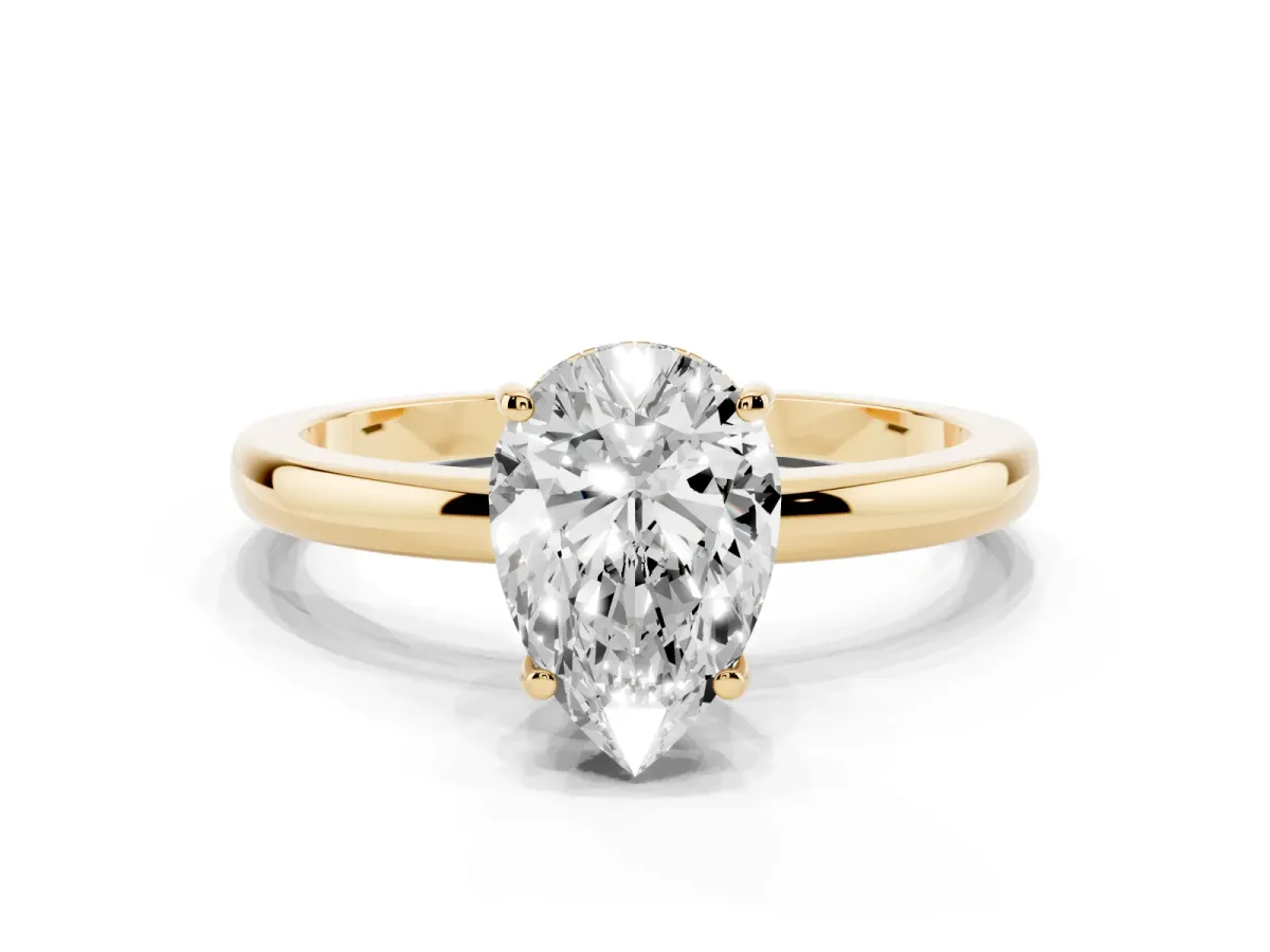 Pear Cut Solitaire Diamond Ring with Prong Setting and Plain Band Yellow gold