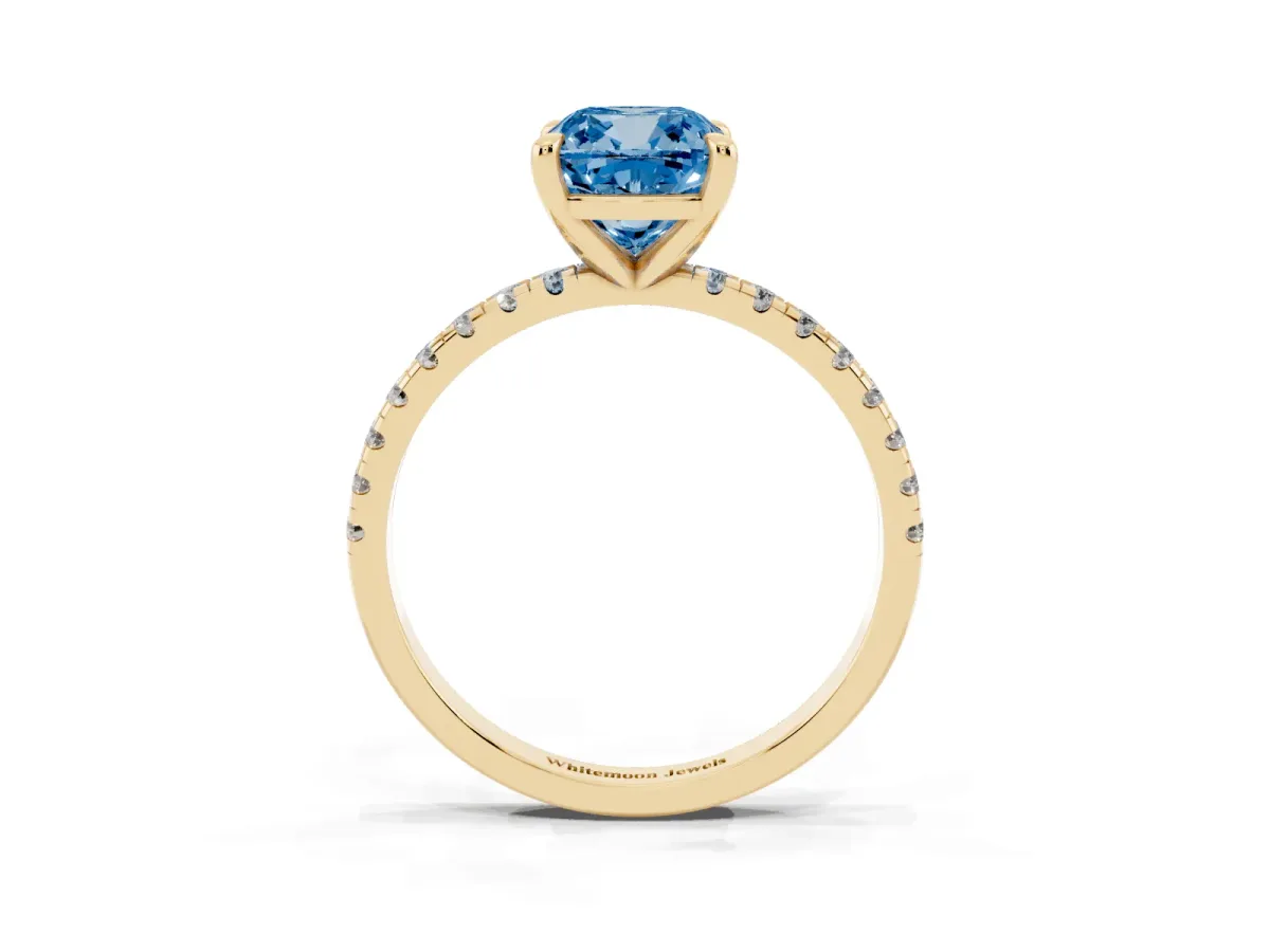 Fancy Blue Cushion Cut Diamond Brilliant Solitaire Ring with Pavé Band and Four-Prong Setting Yellow gold