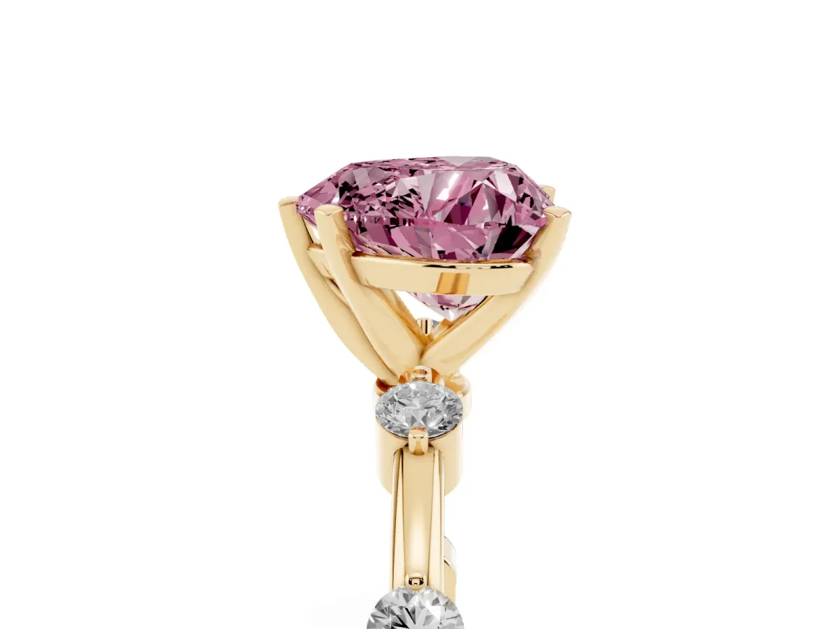 Fancy Pink Heart Cut Solitaire Diamond Ring with Bezel Set Side Stones and Prong Setting Yellow gold