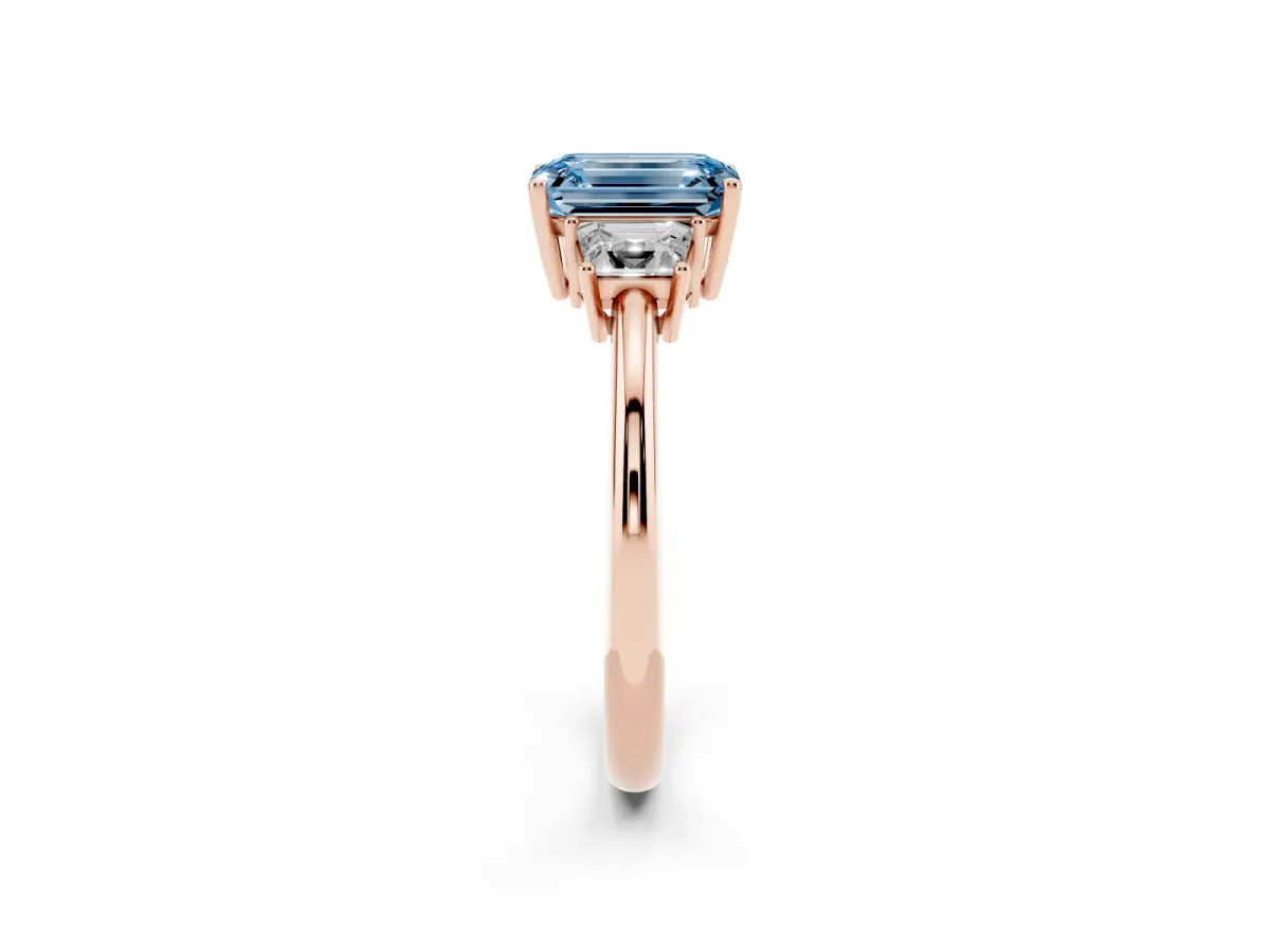 Fancy Blue Emerald Cut Diamond Three-Stone Ring with Trapezoid Side Stones and Prong Setting Rose gold