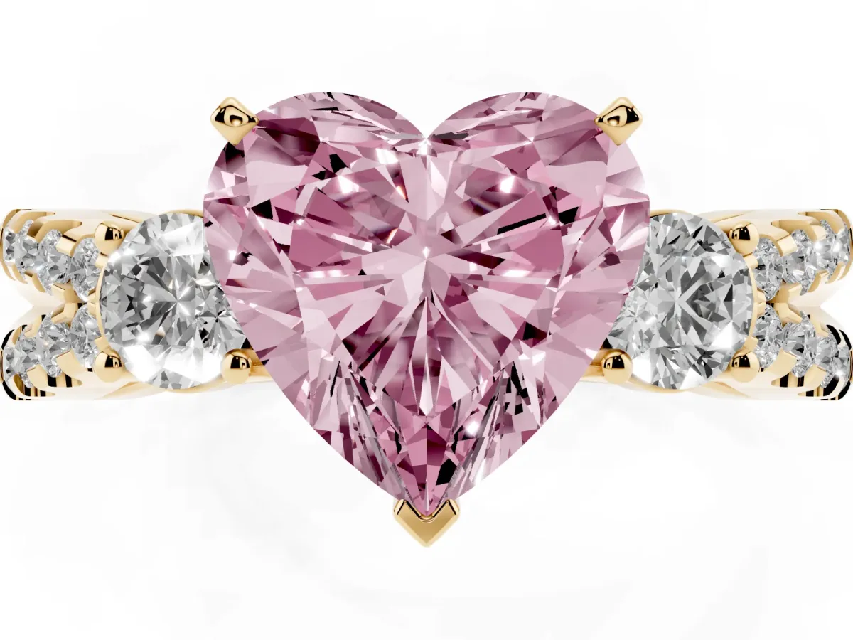 Fancy Pink Heart Cut Diamond Three-Stone Ring with Pavé Split Shank and Four-Prong Setting Yellow gold