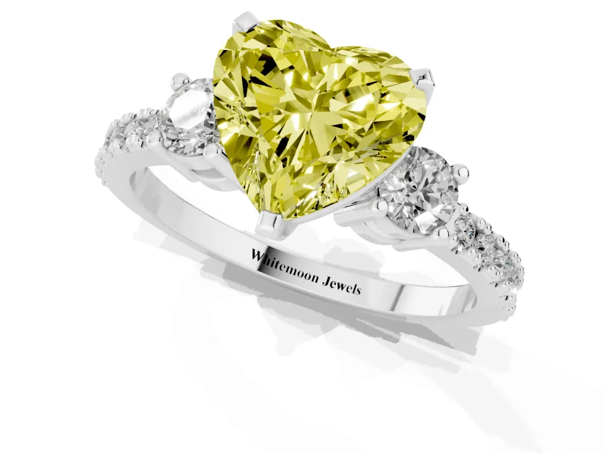 Fancy Yellow Heart Cut Three-Stone Diamond Pavé Band with Prong Setting Platinum