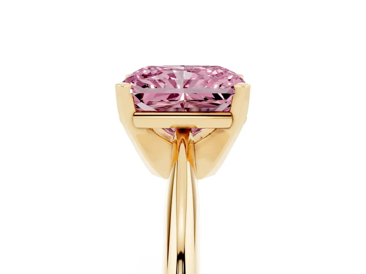 Fancy Pink Radiant Cut Cut Solitaire Ring with Four-Prong Setting on a Classic Band Yellow gold
