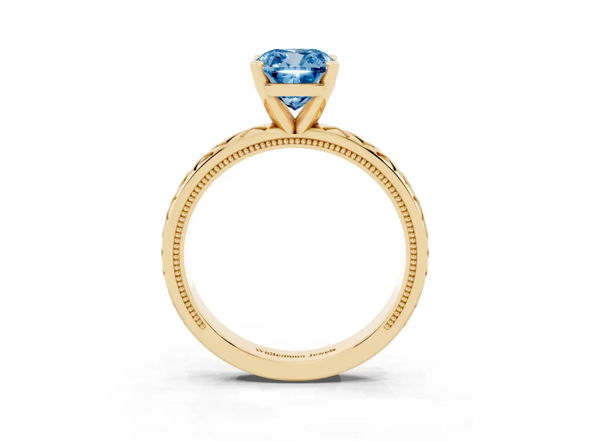 Fancy Blue Cushion Cut Solitaire Diamond Ring with Milgrain and Black Enamel X Pattern Band Yellow gold