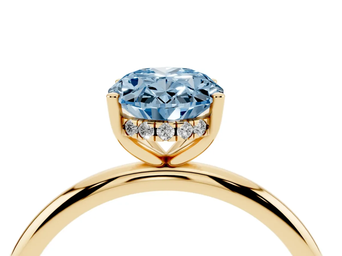 Fancy Blue Oval Cut Cut Solitaire Engagement Ring with Four-Prong Setting and Classic Band Yellow gold