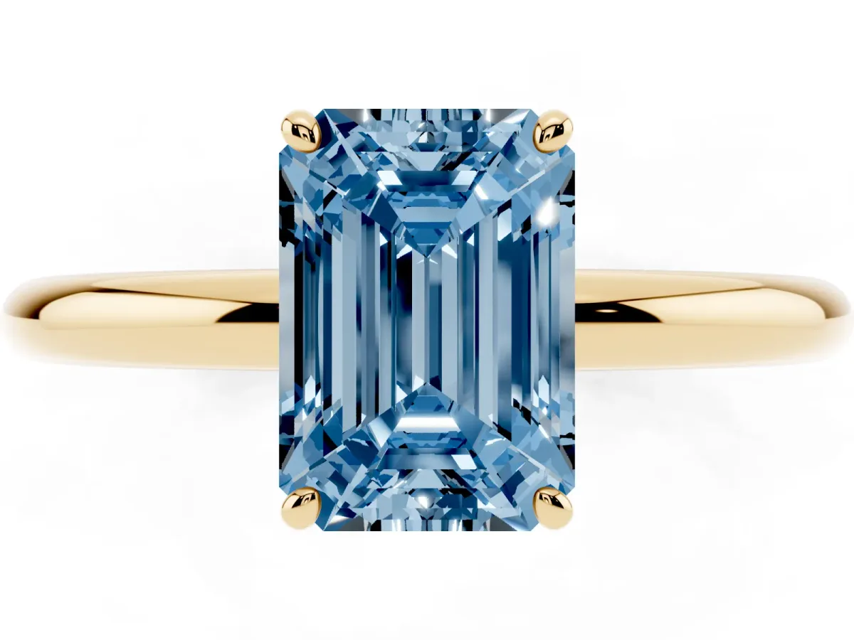 Fancy Blue Emerald Cut Solitaire Diamond Ring with Four-Prong Setting on a Plain Band Yellow gold