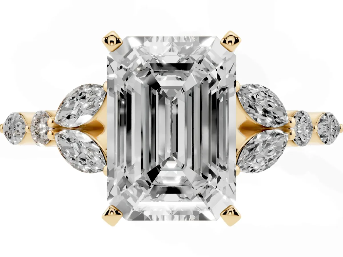Emerald Cut Diamond Solitaire Ring with Side Stones and Four-Prong Setting Yellow gold