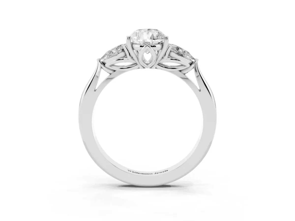 Three-Stone Pear Cut Brilliant Diamond Solitaire Ring with Tapered Band and Four-Prong Setting Platinum