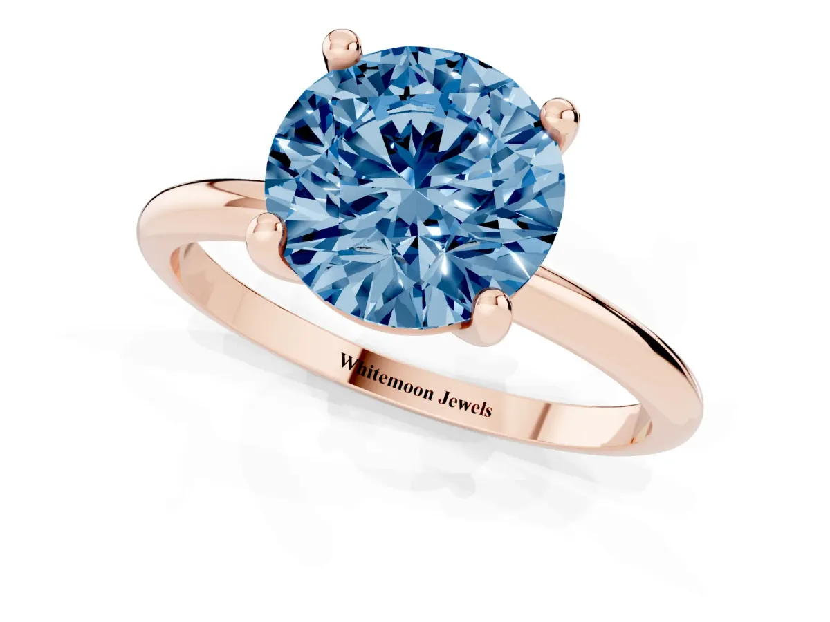 Fancy Blue Round Cut Solitaire Diamond Ring with 4-Prong Setting on a Classic Band Rose gold